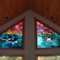 Loon/Wood Duck Trapezoid Window - This set of trapezoid windows was commissioned to me by a gentleman living in the Bradford Point Condominiums on Big St. Germaine Lake, a pristine vacation area located in the Oneida and Vilas County Forests in northern Wisconsin.  The love of nature is captivated by the loons and wood duck, cattails, and calm lake waters, all under sunset skies.